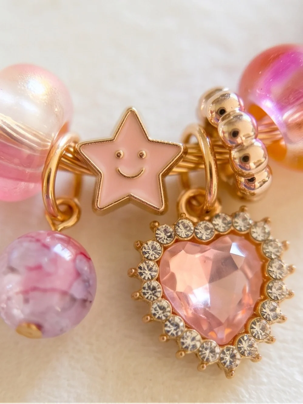 Gold-Tone Pink Charm Bracelet with Heart and Star Accents